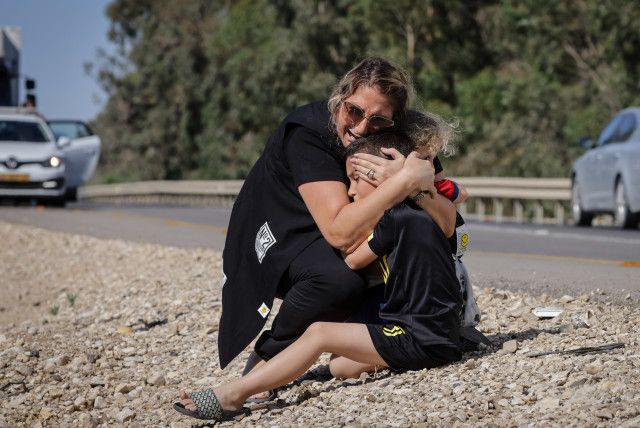 Woman comforting child Woman comforting child